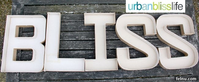 Simple DIY Illuminated Signage Guide 6 Cutting 'X' shapes in the paper mache letters for the light bulbs