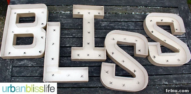 Simple DIY Illuminated Signage Guide 8 Spray painting the paper mache letters