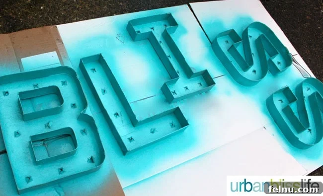 Simple DIY Illuminated Signage Guide 9 The paper mache letters after being spray painted a turquoise color