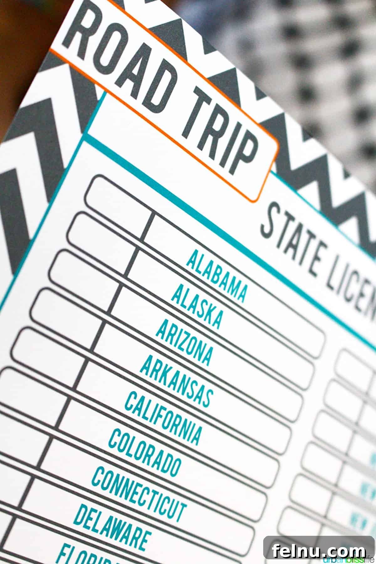 Fun Free Printable Games for Road Trips 6 Close-up of a child's hands pointing at different states on the road trip license plate game, highlighting the interactive fun.