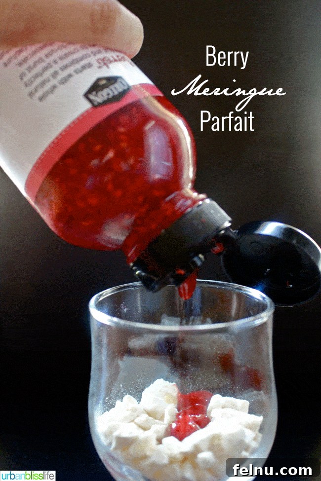 Adding berry puree to the meringue cookie layer.