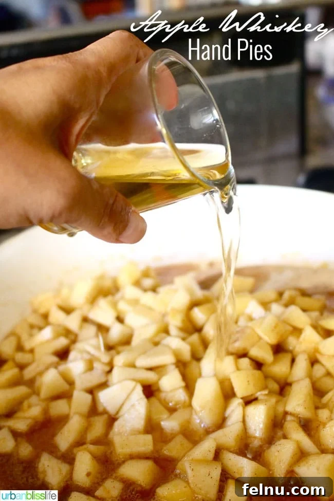 Apple Whiskey Hand Pies
Rustic Apple Whiskey Turnovers 4 Pouring Whiskey into Apple Filling