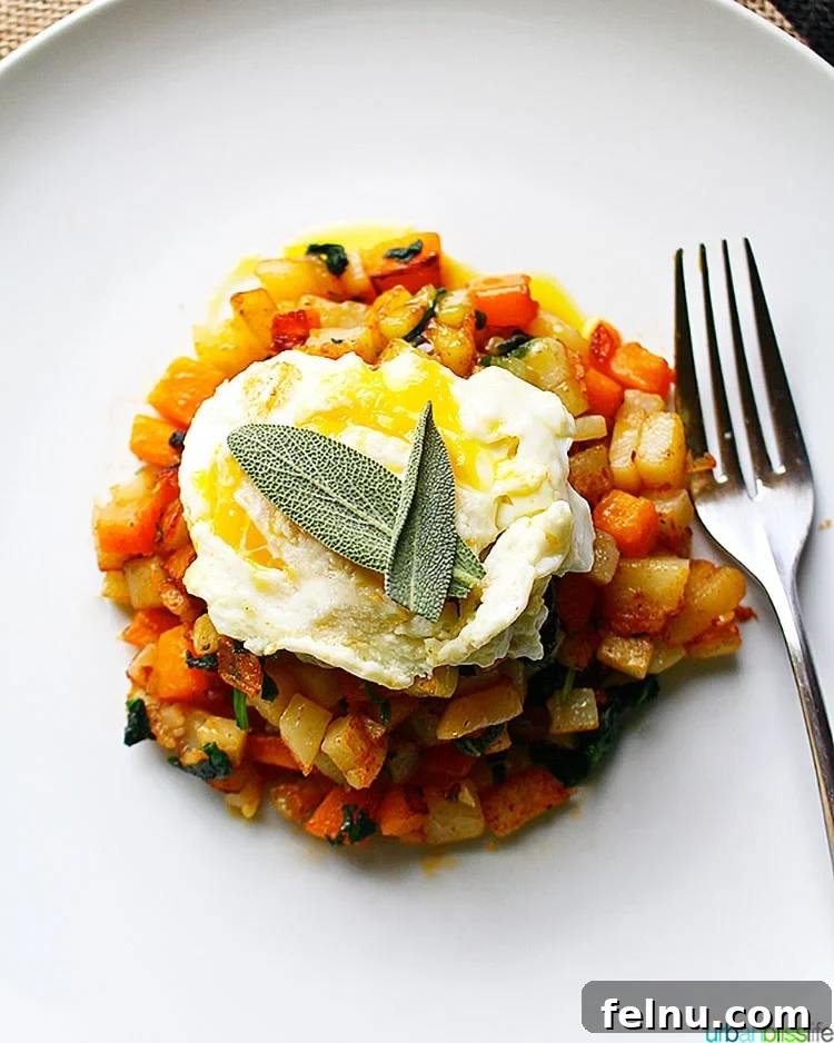 Butternut Squash Hash topped with fresh sage and a perfectly cooked egg, ready to be enjoyed as a healthy meal
