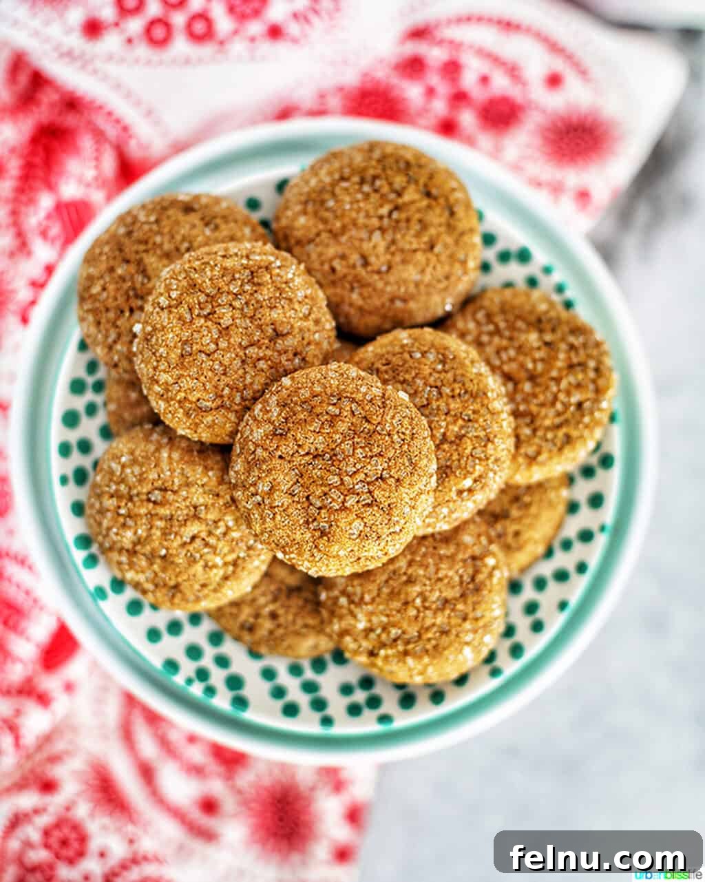 Chewy Ginger Molasses Cookies Gingersnap Delights: Soft & Chewy Molasses Cookies 3 A stack of chewy ginger molasses cookies on a plate