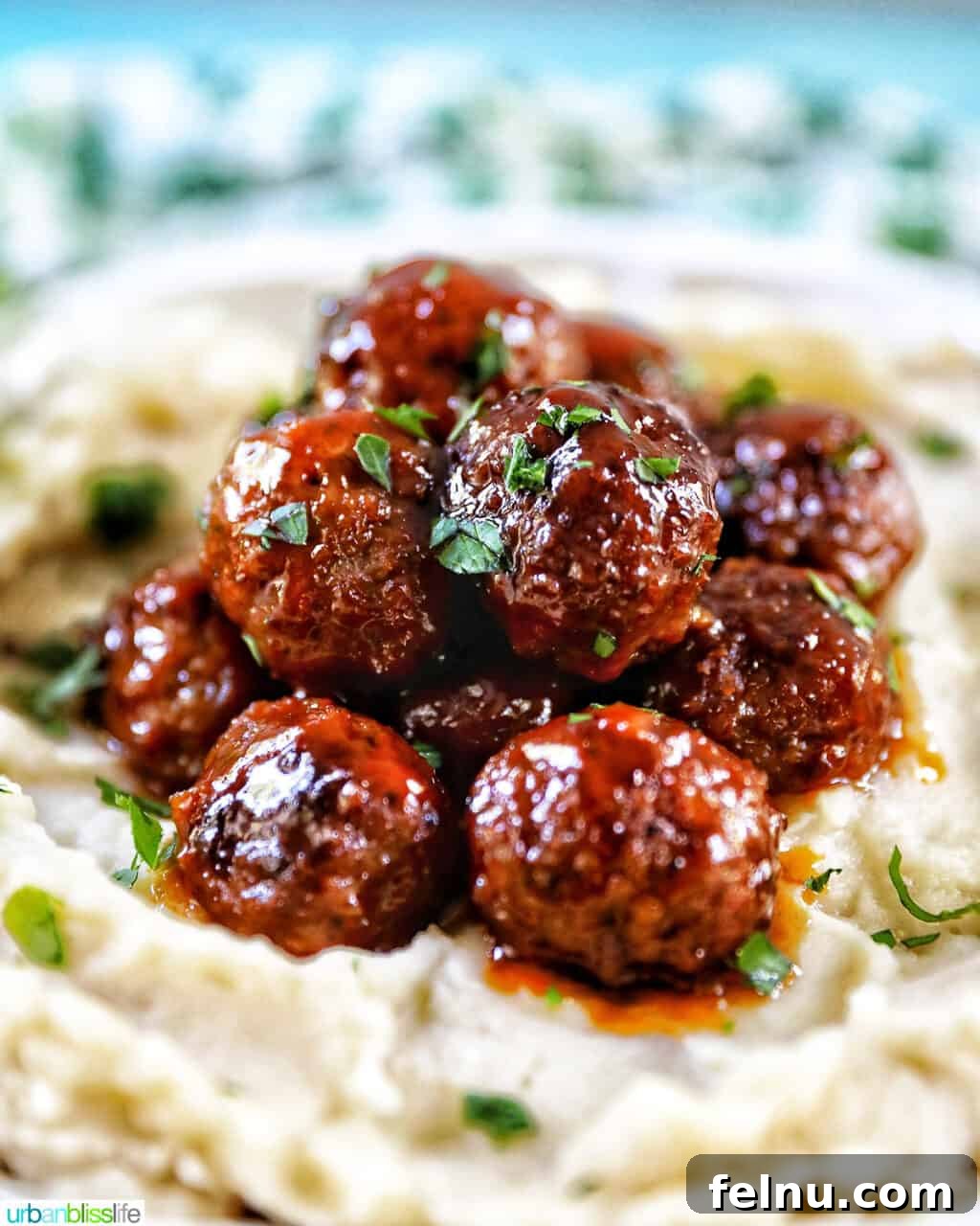 Honey Bourbon Glazed Meatballs (Slow Cooker Recipe) 2 Slow cooker honey bourbon meatballs served over mashed potatoes.