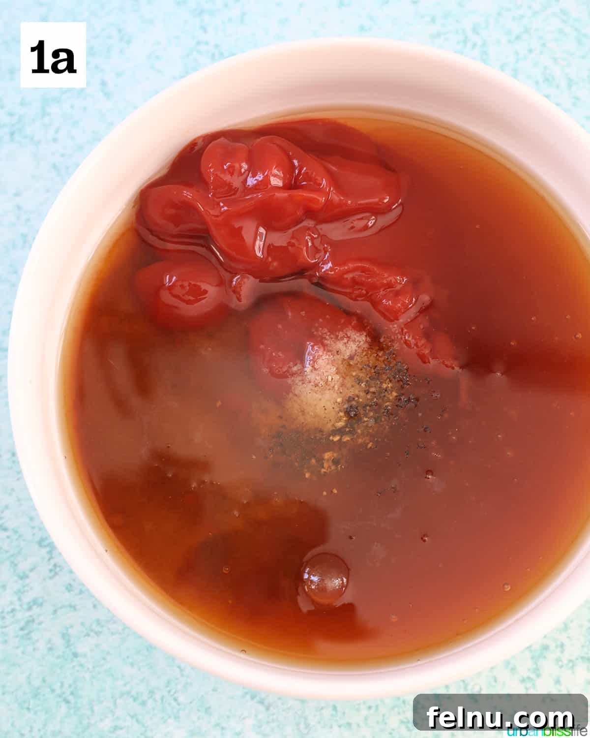 Honey Bourbon Glazed Meatballs (Slow Cooker Recipe) 5 Ingredients for the honey bourbon sauce in a white bowl.