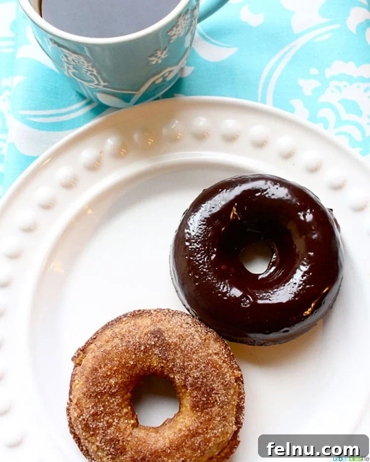 Freshly baked paleo donuts on a cooling rack, ready for topping