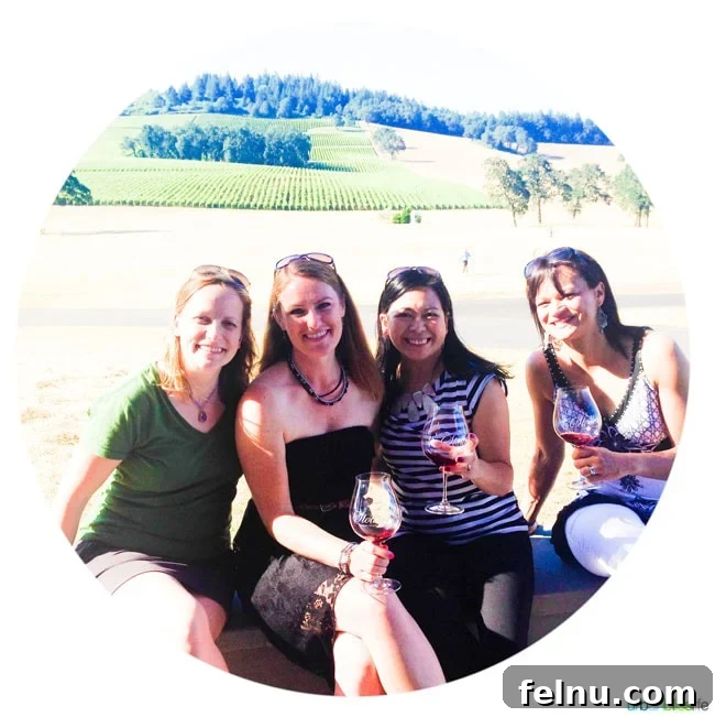 Sip, Savor, & Celebrate: Your 5-Stop Oregon Wine Country Girls' Weekend 2 Girls enjoying a wine tasting weekend in Oregon Wine Country, clinking glasses at a beautiful vineyard.