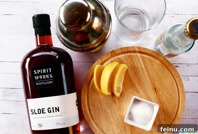 Sloe Gin Fizz The Perfect Monday Mix 3 Ingredients for a Sloe Gin Fizz cocktail: Sloe gin bottle, lemon, sugar, club soda