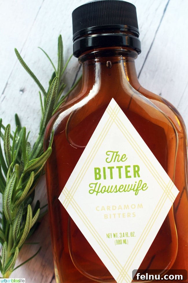 The Summer Backyard Gin Fizz 6 Close-up of The Bitter Housewife Cardamom Bitters bottle