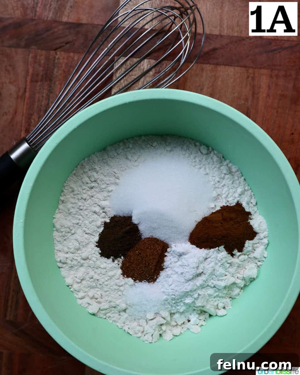 Crispy Cinnamon Apple Fritters 6 Dry ingredients for apple fritter donuts in a bowl.