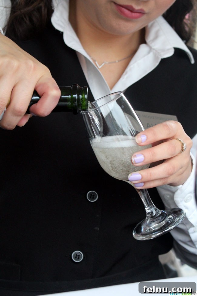 Server Pouring Champagne on the Mount Hood Railroad