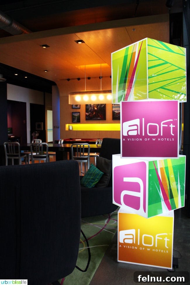 Portland's Indie Stays: Boutique Hotels with Personality 6 Cool Hotels in Portland, Oregon: ALoft Hotel lobby with contemporary art and vibrant seating