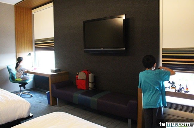 Portland's Indie Stays: Boutique Hotels with Personality 8 Cool Hotels in Portland, Oregon: ALoft Hotel guest room with vibrant decor and comfortable bed