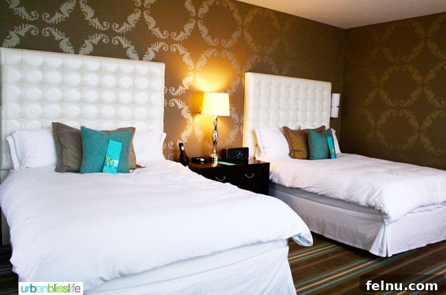 Portland's Indie Stays: Boutique Hotels with Personality 10 Cool Hotels in Portland, Oregon: The Nines Hotel guest room with luxurious bedding and elegant design