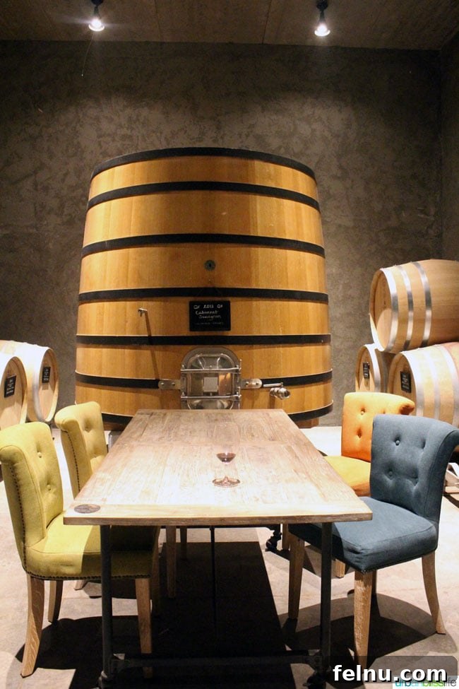 Discover Va Piano Winery Walla Wallas Premier Vineyard 5 Large wine barrels in Va Piano Winery's barrel room, cozy seating area