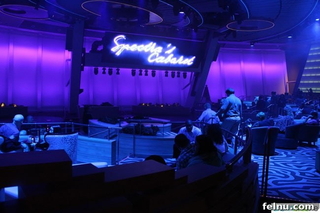 Anthem of the Seas Entertainment Extravaganza 11 A vibrant scene from Spectra's Cabaret in Two70, featuring performers in elaborate costumes amidst a digital backdrop.