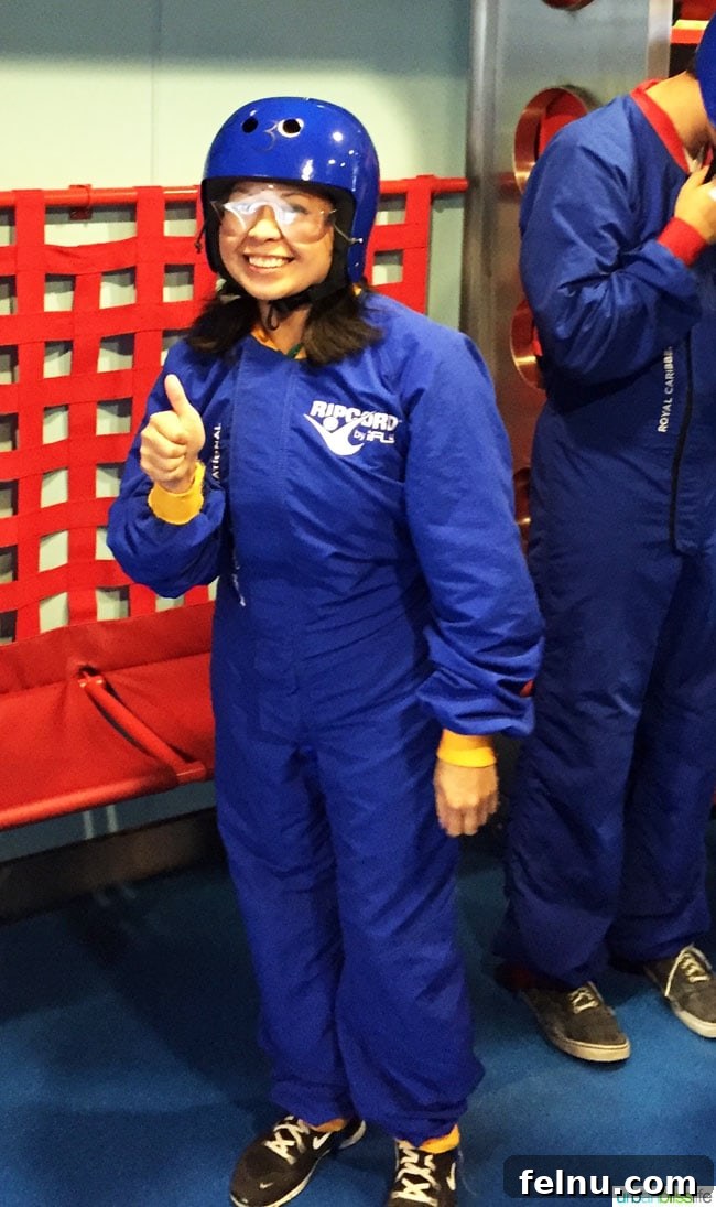 Family Fun Aboard Anthem of the Seas 4 Instructor helping a participant during iFly skydiving on Anthem of the Seas