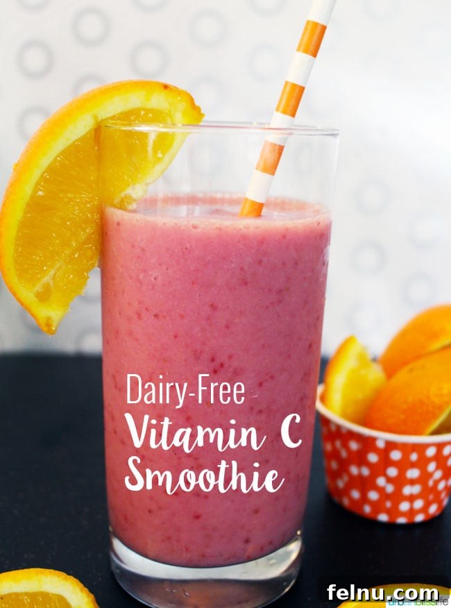 Radiant C Almond Smoothie 5 Side view of a tall glass of Dairy-Free Vitamin C Smoothie