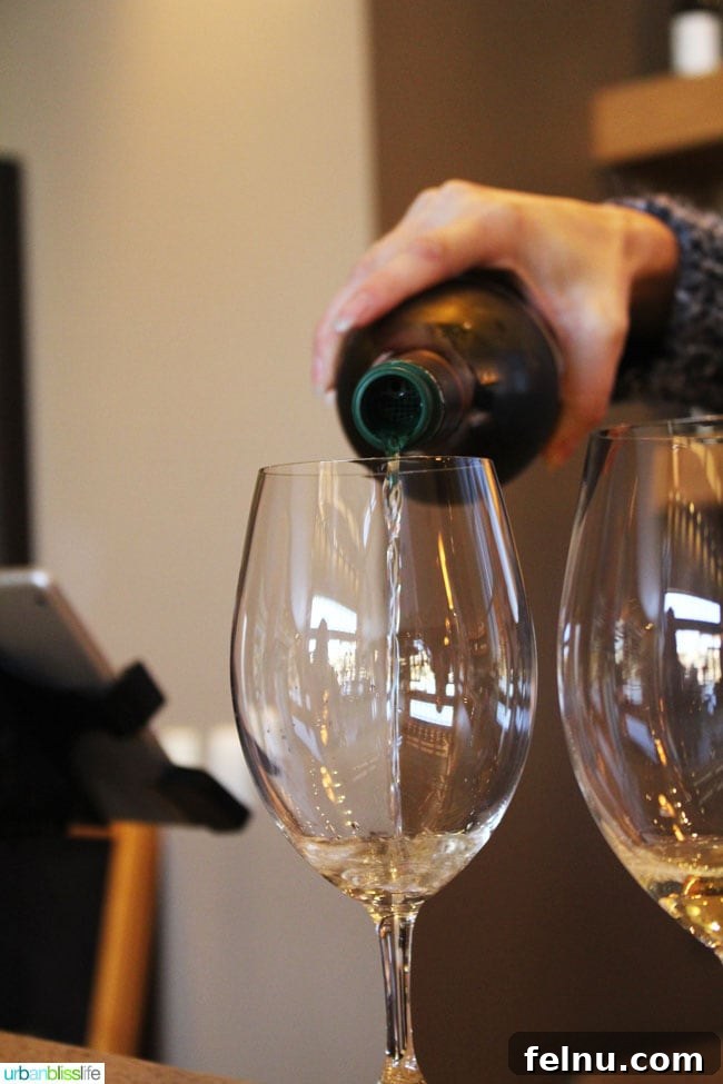 Waterbrook Winery: A Taste of Walla Walla 9 White wine being poured into a glass at Waterbrook Winery.