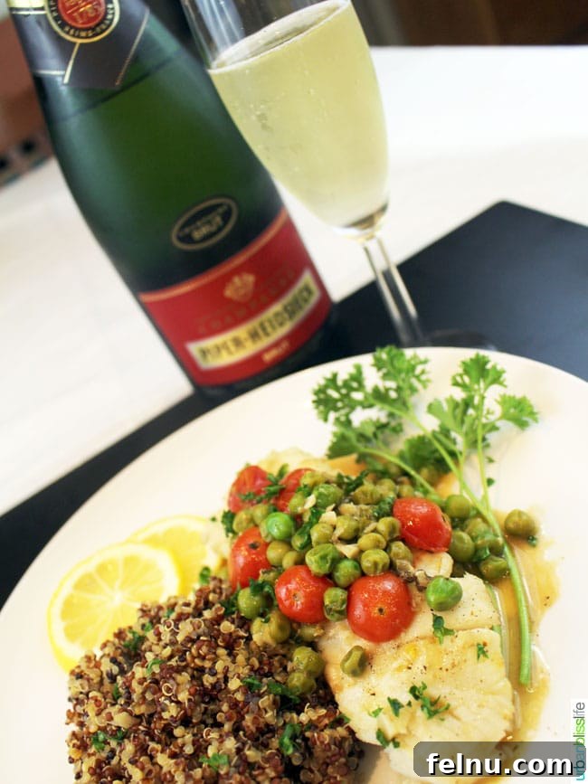 Wine-Poached Halibut: A Simple Seafood Delight 3 Wild Alaskan Halibut Poached with Tomatoes and Peas Wine Sauce, recipe on UrbanBlissLife.com