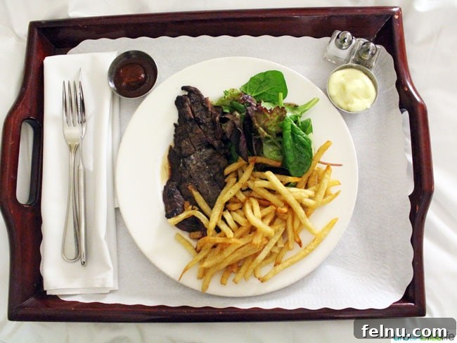 A close-up of the perfectly cooked steak frites, highlighting the quality of the ingredients and preparation.