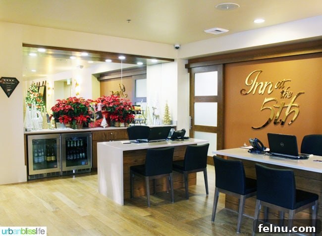 The beautifully designed lobby of the Inn at the 5th, featuring comfortable seating and welcoming staff.