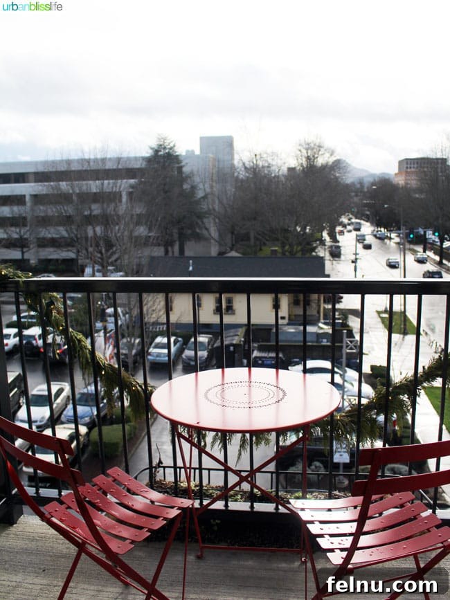 The private balcony of a guest room at the Inn at the 5th, offering views of downtown Eugene.