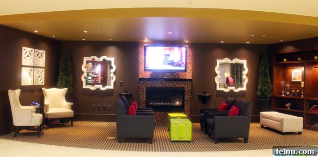 A comfortable lounge area in the lobby of The Maxwell Hotel Seattle, featuring unique artwork and stylish furniture.