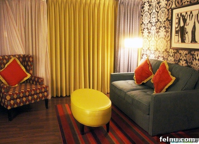 A cozy sitting area in the Prima Donna Suite at The Maxwell Hotel Seattle, offering a relaxing space to unwind.