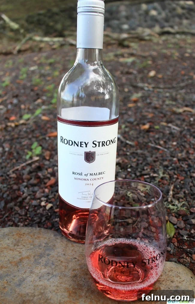 Rodney Strong Vineyards Your Sonoma Wine Escape 15 Glass of rosé wine with bottle of Rodney Strong Rosé of Malbec