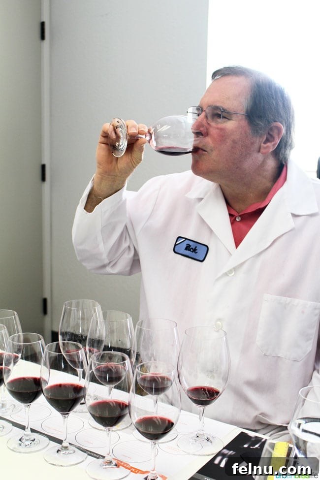 Rodney Strong Vineyards Your Sonoma Wine Escape 26 Head Winemaker Rick Sayre inspecting a wine sample during blending session