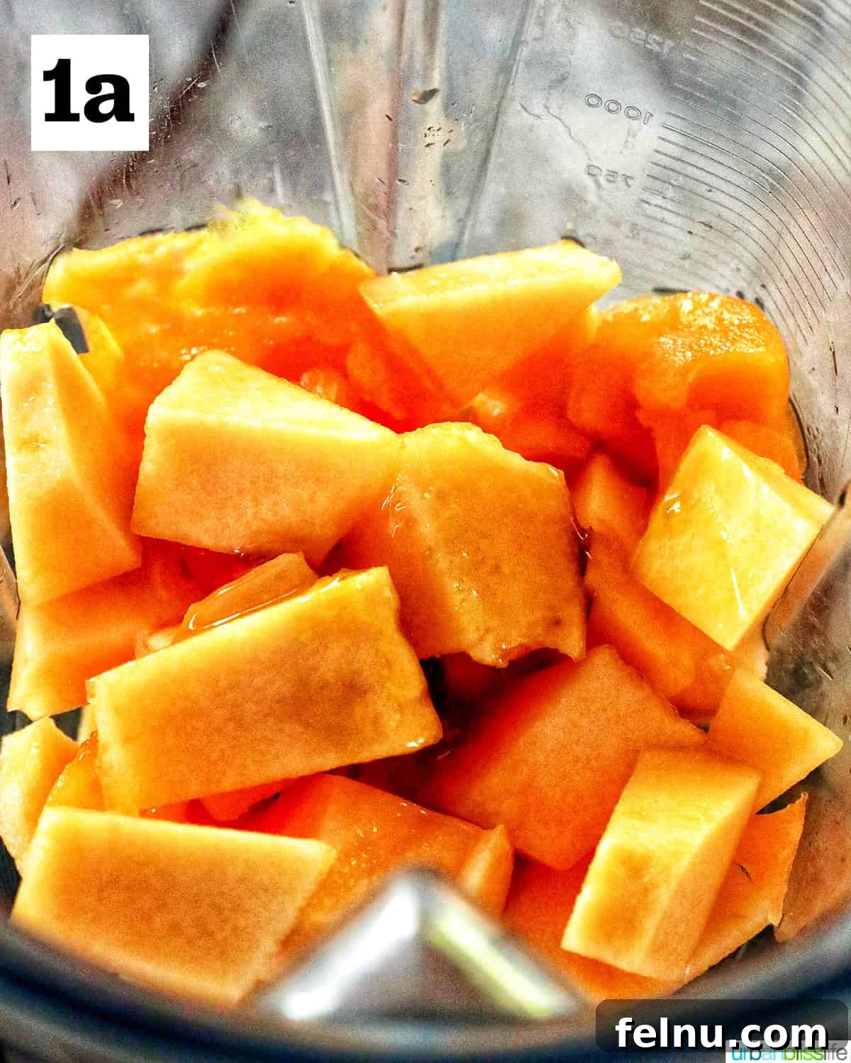 Chopped cantaloupe to make melon cocktails in a blender.