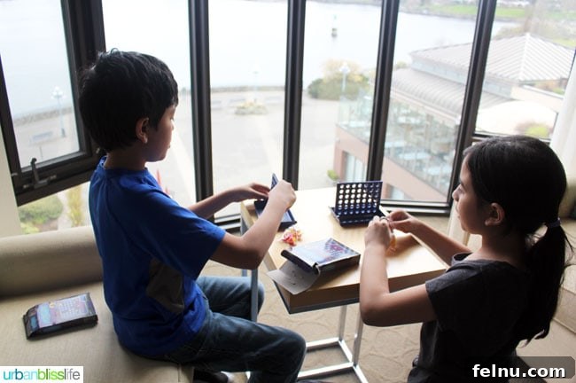 Kids playing Connect Four at the Delta Victoria Ocean Pointe Resort.