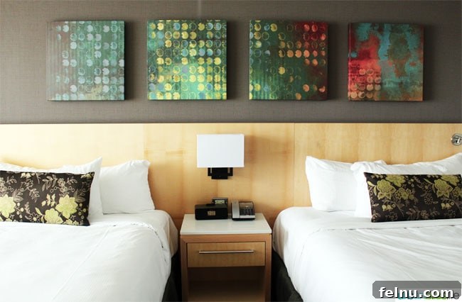 Comfortable beds in a guest room at the Delta Victoria Ocean Pointe Resort.