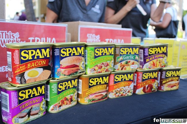 Variety of SPAM cans showcasing different flavors available on display
