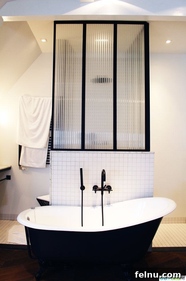 Unlock Your Perfect Amsterdam Stay 8 Luxurious guest room bathroom at Morgan & Mees hotel with a free-standing tub
