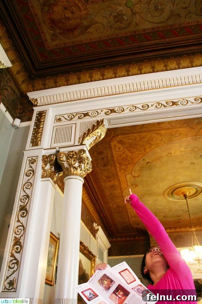 Victoria BC Family Fun: Top 5 Kid-Friendly Adventures 5 Child holding an 'I Spy' clue brochure at Craigdarroch Castle