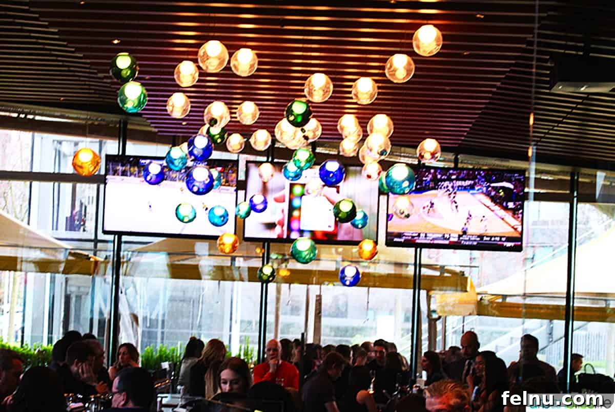 Vancouver BC's Cactus Club Cafe 4 colorful round light fixture in the ceiling at Cactus Club Cafe Coal Harbour Vancouver BC.