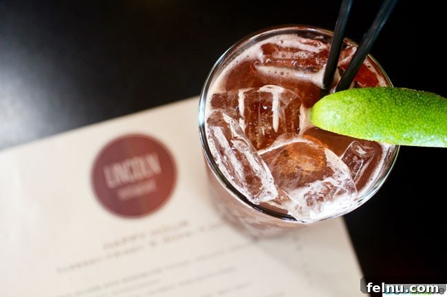 A beautifully crafted cocktail at Lincoln Restaurant, exemplifying the attention to detail in their drink offerings.
