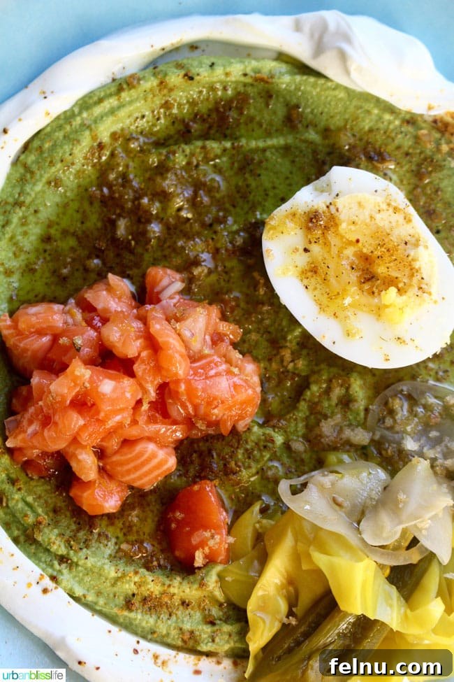 The Asparagus Hummus dish at Lincoln Restaurant, featuring labneh, egg, and salmon.