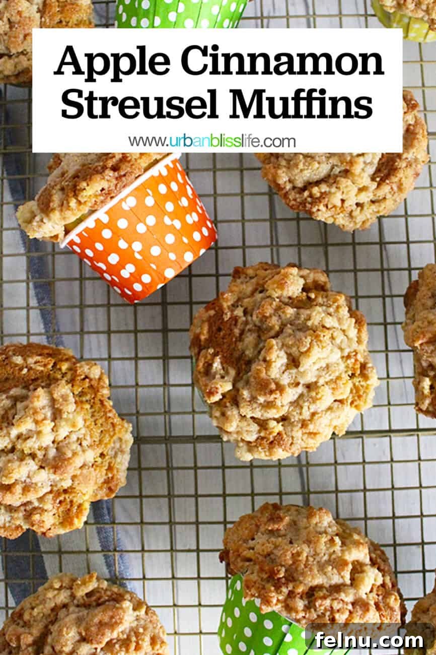 Cinnamon Apple Crumble Muffins 8 Several cinnamon streusel muffins with a text overlay for Pinterest.