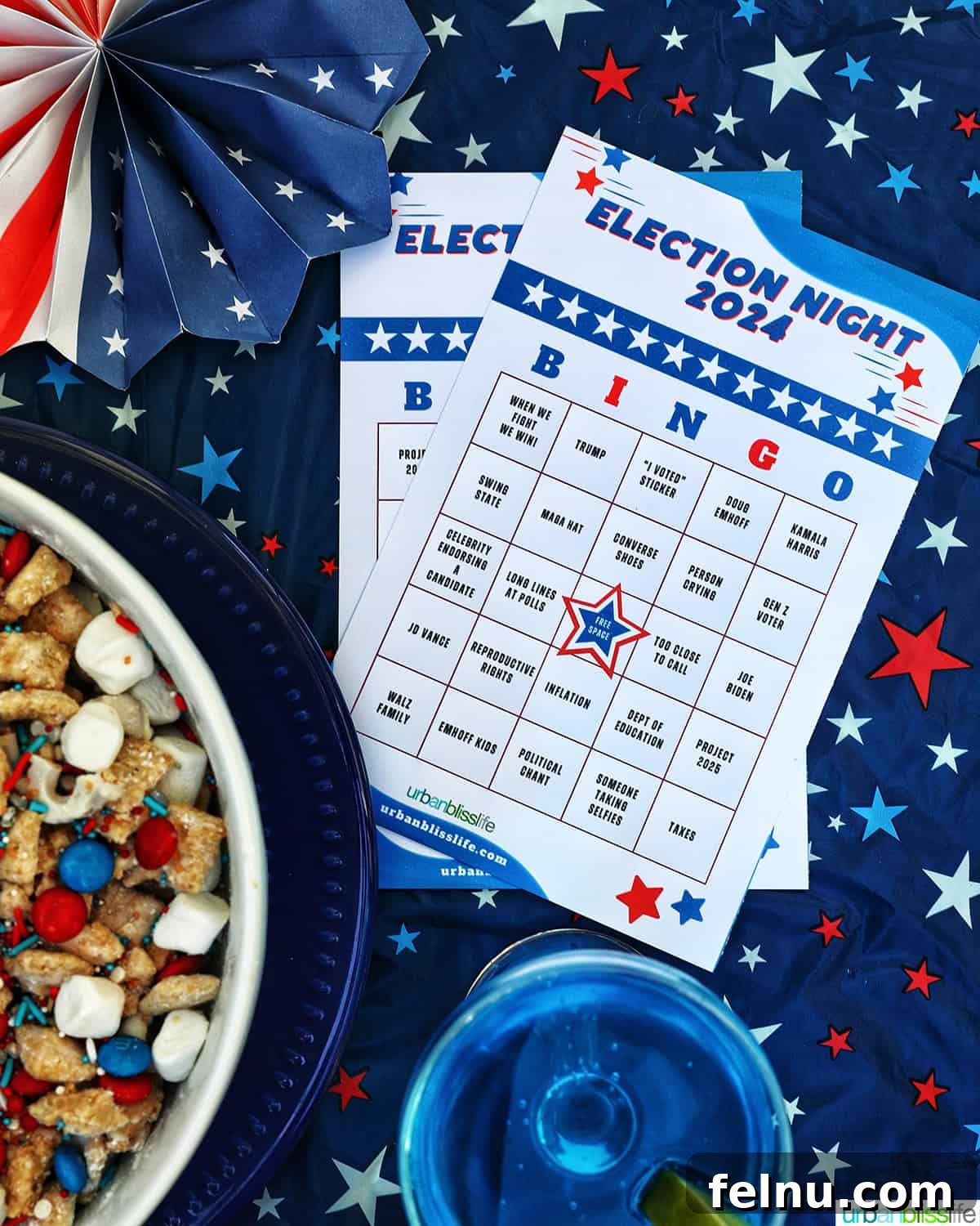 Election Celebration: Games and Printables 2 Election bingo cards next to a blue wave cocktail and bowl of red, white, and blue trail mix.