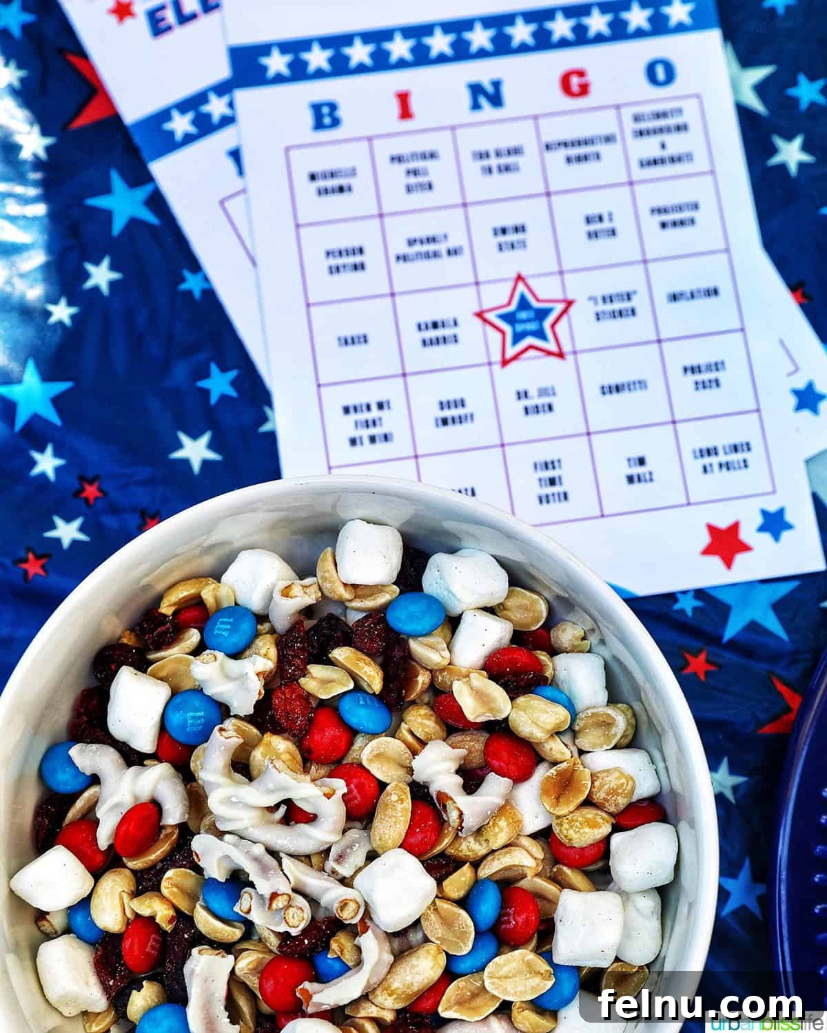 Election Celebration: Games and Printables 4 Bowl of red, white, and blue trail mix with Election Bingo card for 2024.