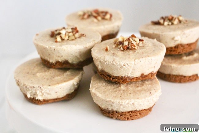 Effortless Vegan Cheesecake Bites 5 Landscape photo of stacked vegan cheesecake bites on a white cake platter.
