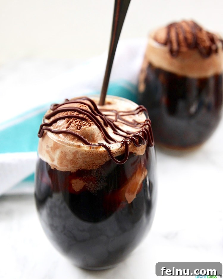 25 Irresistible Valentine's Day Treats and Sips 4 Two glasses of Boozy Chocolate Peanut Butter Floats garnished with chocolate shavings.