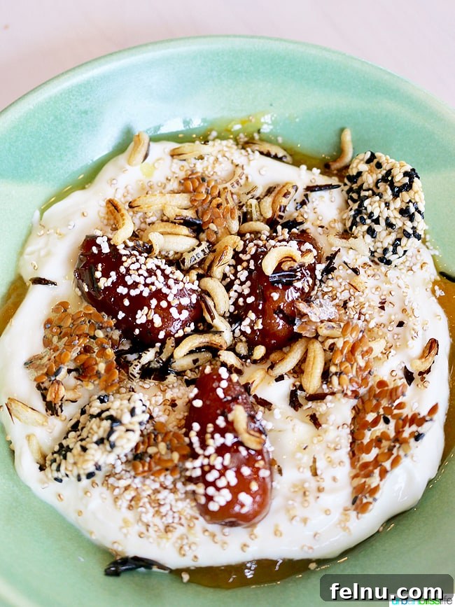 Middle Eastern Brunch Magic at Tusk 16 A large, beautifully garnished yogurt bowl at Tusk, featuring fruit, dates, puffed grains, and squash, a hearty and healthy option.