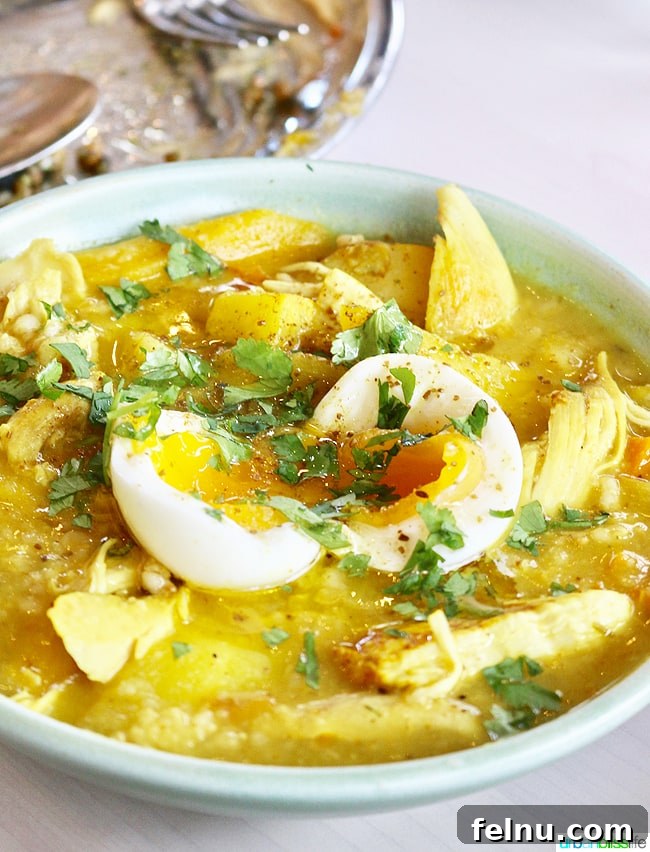 Middle Eastern Brunch Magic at Tusk 19 A comforting bowl of Koda Rice Porridge with curry, chicken, ginger, and egg, perfect for a cold day.
