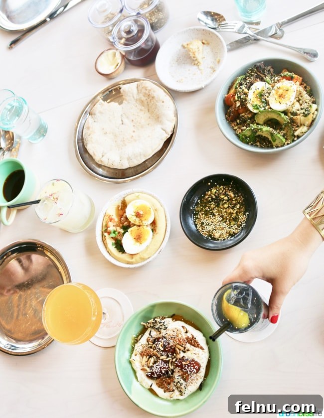 Middle Eastern Brunch Magic at Tusk 3 Overhead view of a beautifully set table at Tusk Portland, showcasing multiple Middle Eastern dishes and drinks ready for sharing.