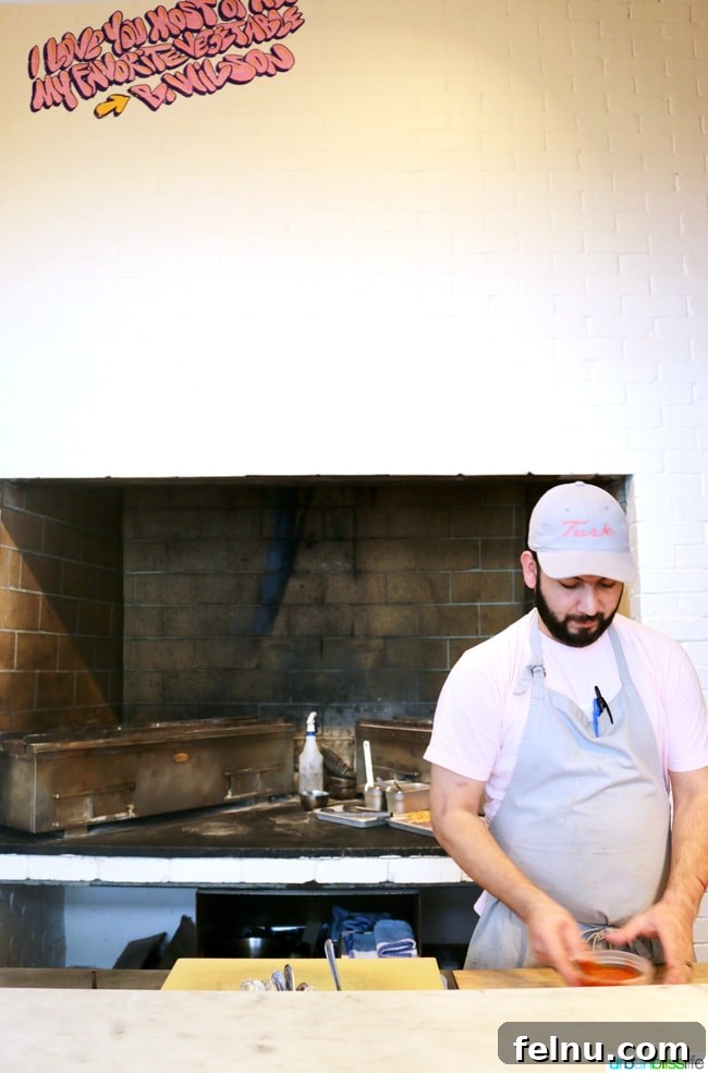 Middle Eastern Brunch Magic at Tusk 23 Executive Sous Chef Joe Deibler working diligently in the bustling kitchen at Tusk Portland.
